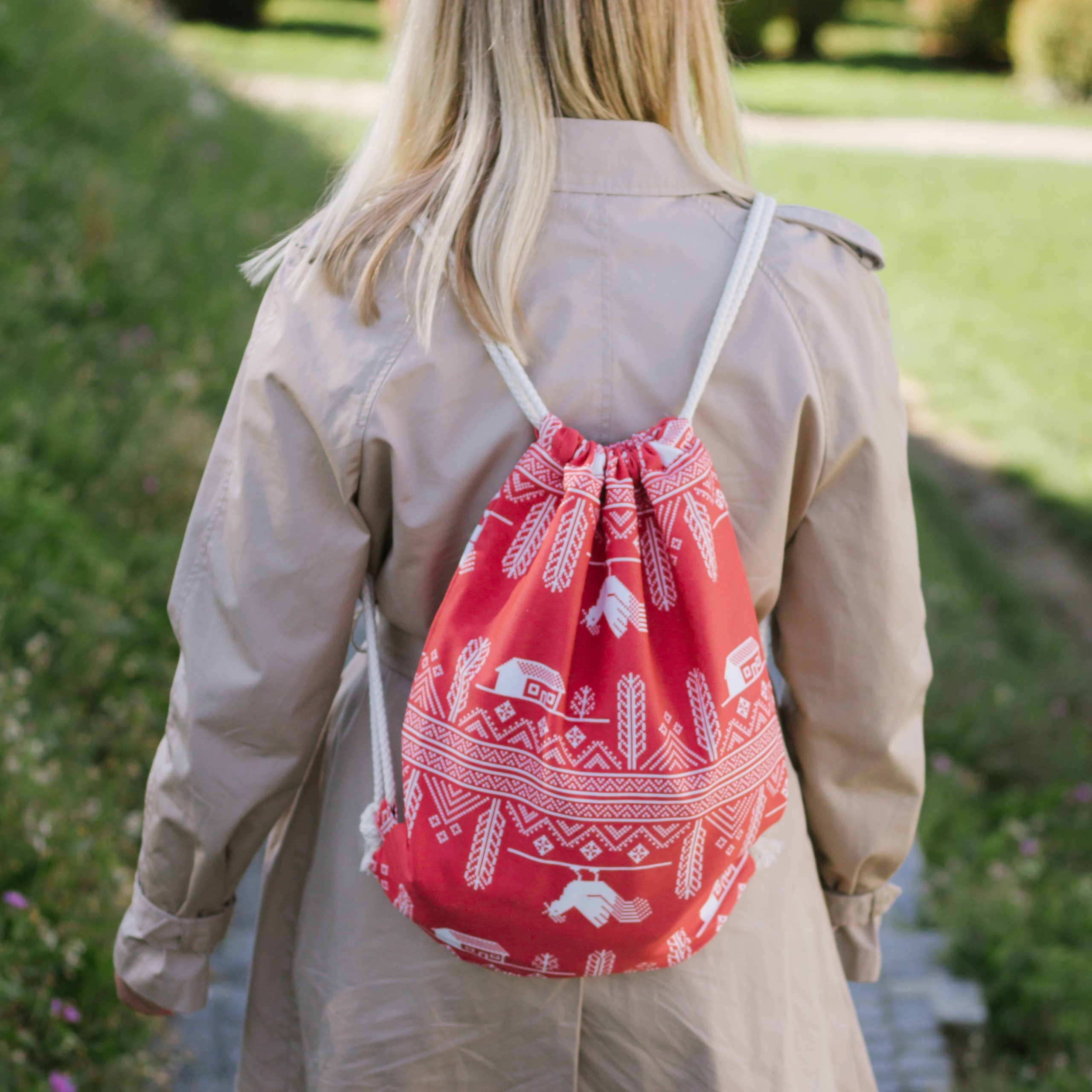 girl in the nature with quality personalized red bag