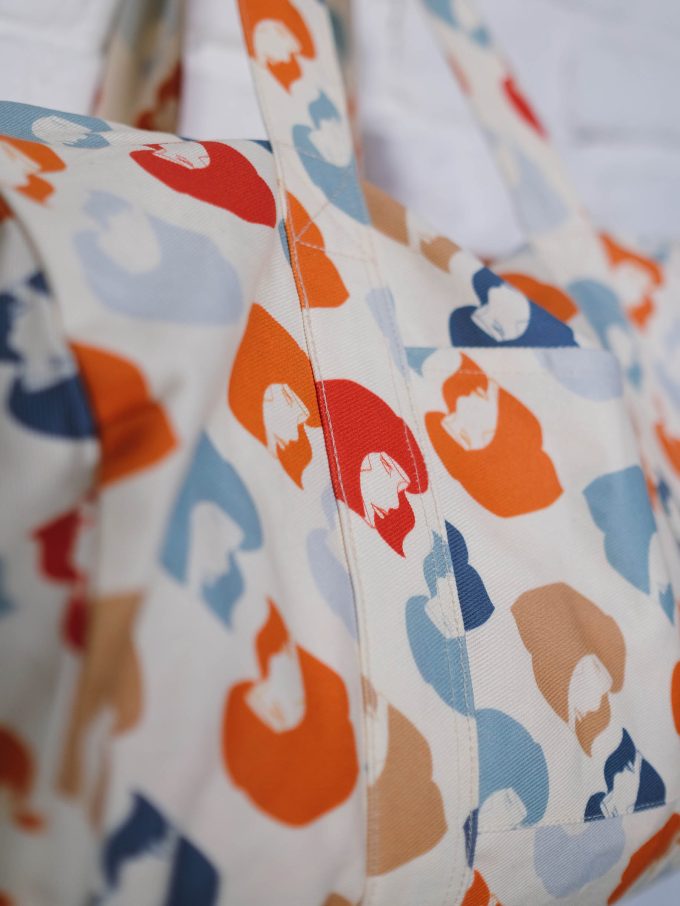 Detail of large white bag with orange, red, brown and blue details from LFP collection