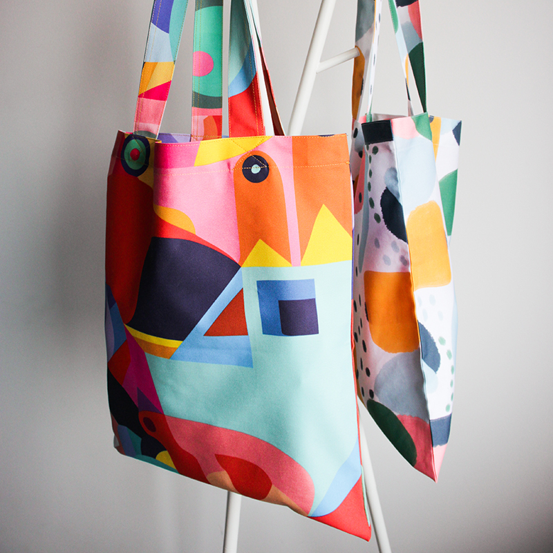 two personalized colourful tote bags