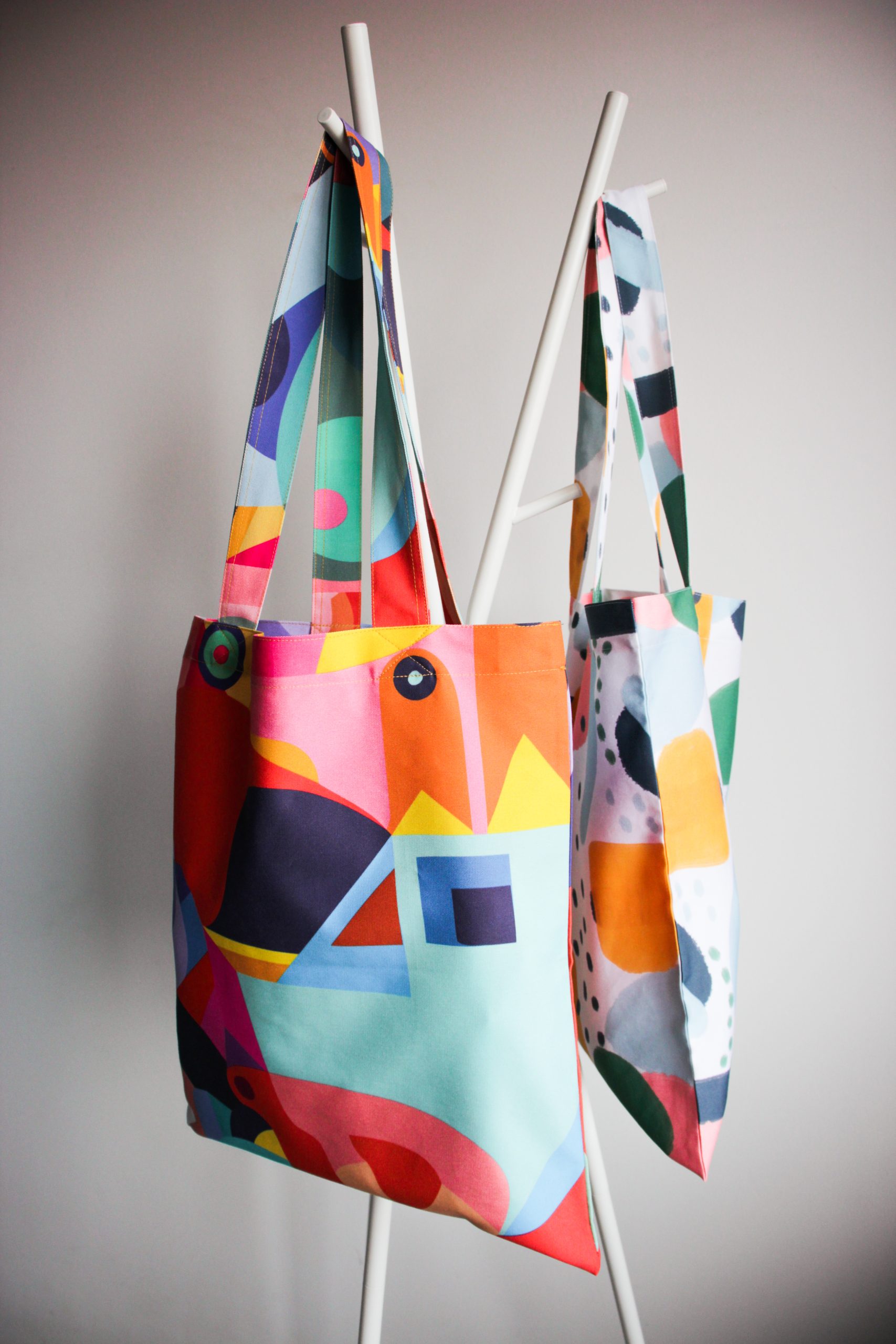 two creative personalized tote bags