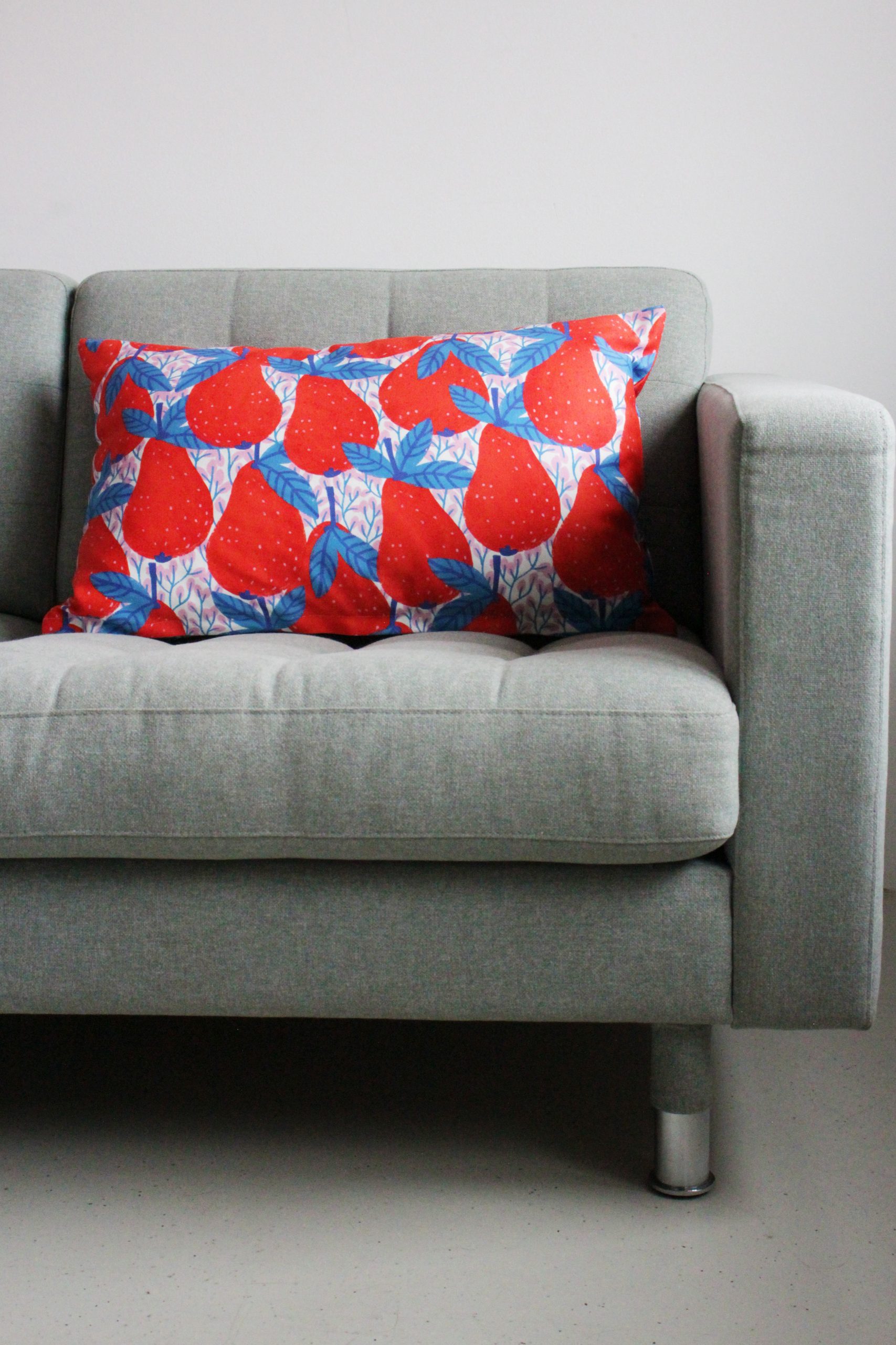 grey sofa and colorful personalized pillow